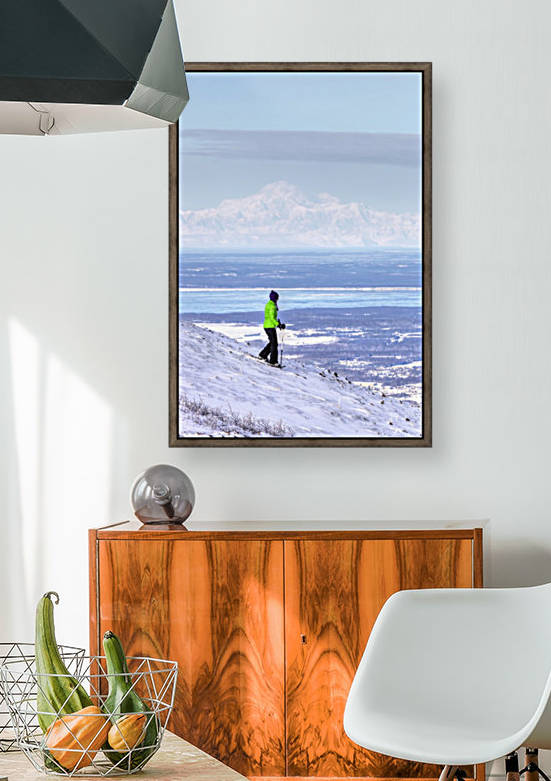 Woman snowshoeing on Blueberry Hill at the Glen Alps area of Chugach State Park with Mt. McKinley (Denali) in the background, Anchorage, Southcentral Alaska, Winter, HDR by PacificStock