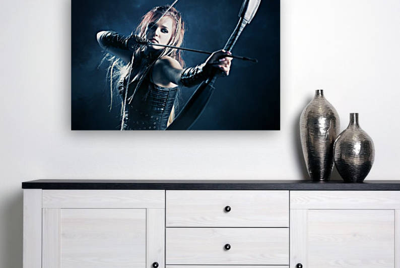 Woman archer aiming arrow by Johan Swanepoel