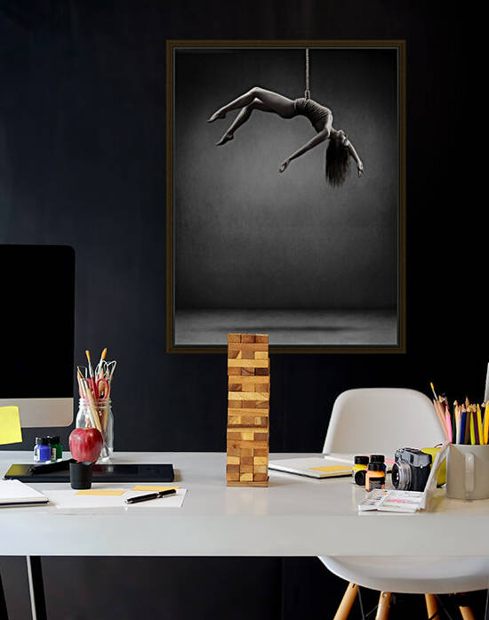 Woman hanging on a rope by Johan Swanepoel