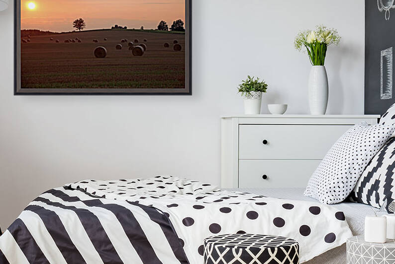 Setting Sun And Hay Bales by Deb Oppermann