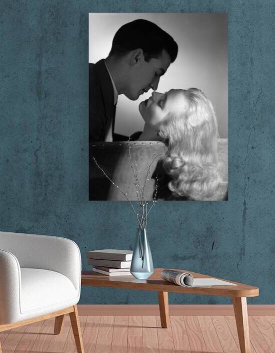 1950s COUPLE EMBRACING ON SOFA ABOUT TO KISS 178698 by Panoramic Images