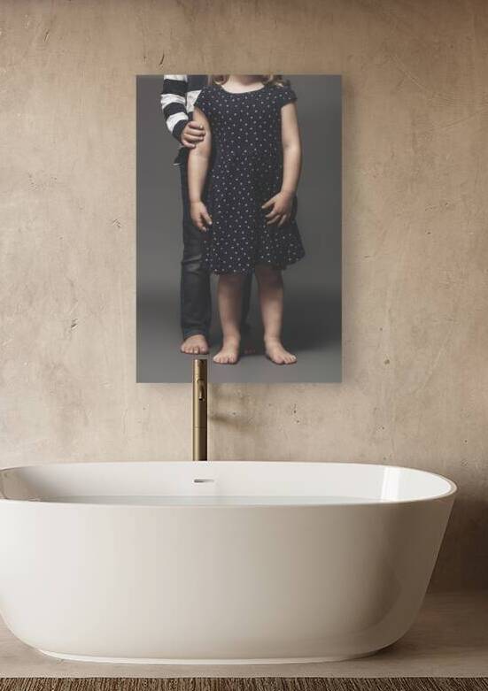 portrait of sibling children barefoot by Gualtiero Boffi