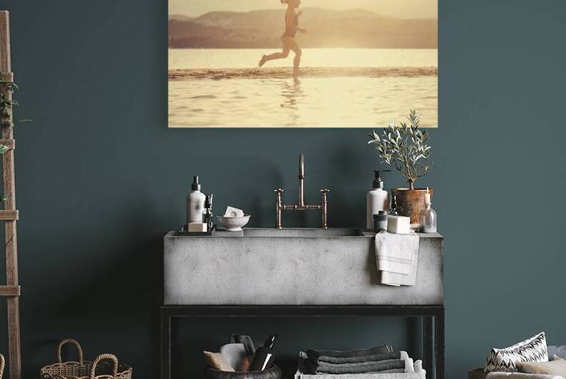 little girl at the seaside running on the beach  by Gualtiero Boffi