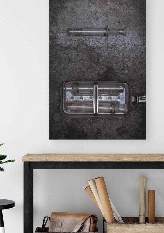 old glass syringes in metal box  by Gualtiero Boffi