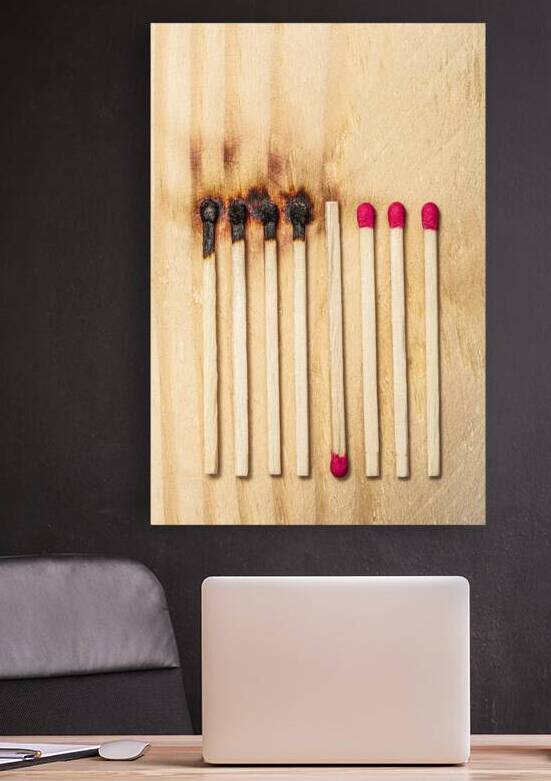 matches in a row some of which were lit and burnt by Gualtiero Boffi