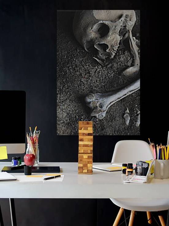 skull and human bones buried  by Gualtiero Boffi