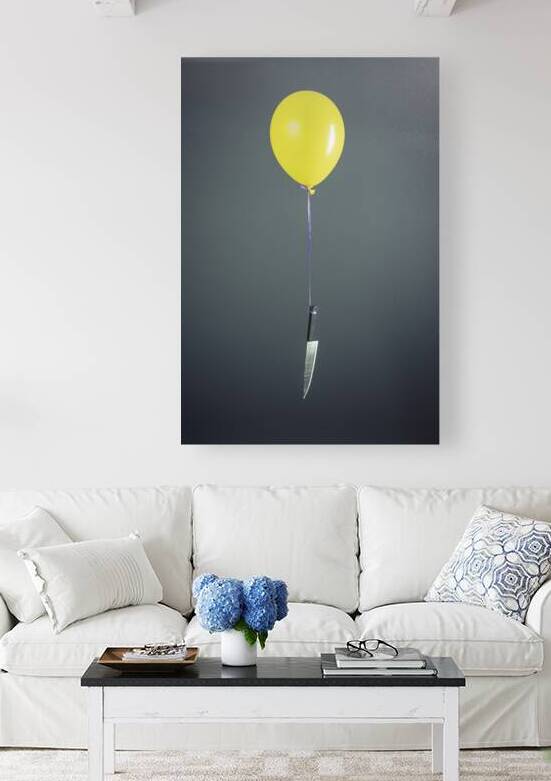 Large knife tied to a yellow balloon by Gualtiero Boffi