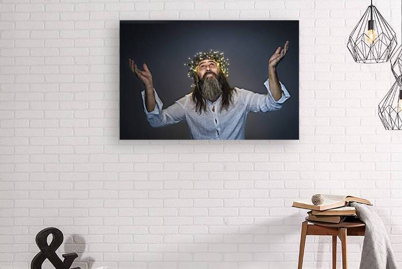 man with crown of led lights and raised arms  by Gualtiero Boffi