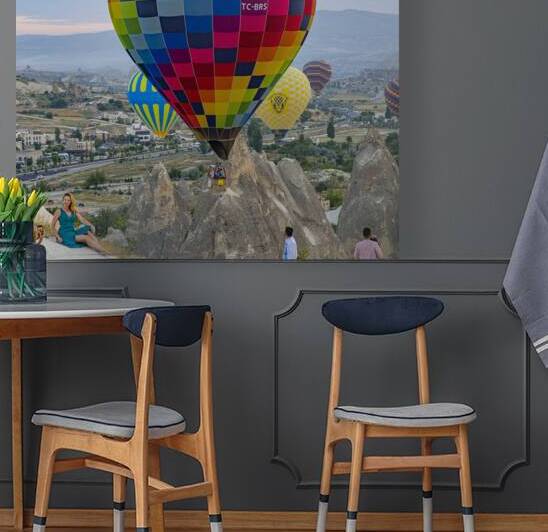 tourists take pictures with hot air balloons in the background by Gualtiero Boffi