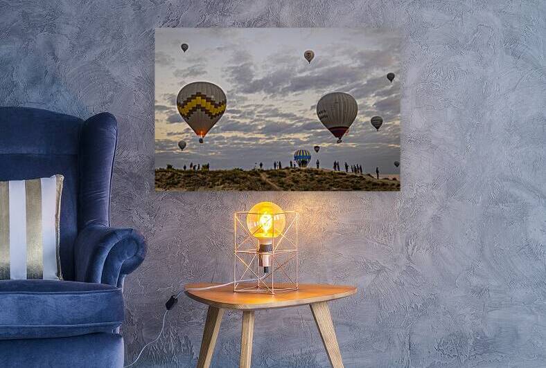 tourists watch the hot air balloon show above goreme at dawn by Gualtiero Boffi