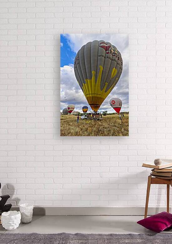  hot air balloons landing in goreme hills by Gualtiero Boffi