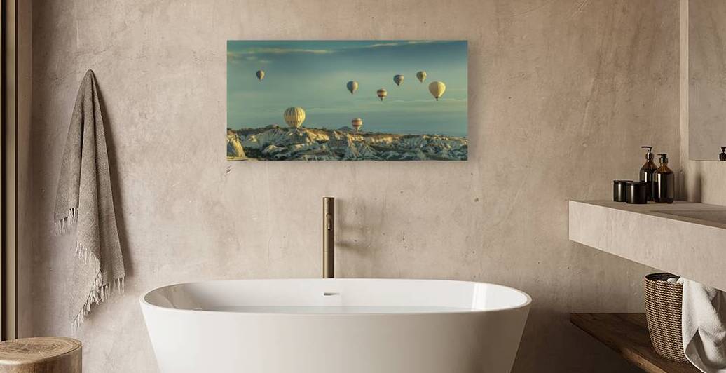 hot air balloons fly over goreme at dawn. by Gualtiero Boffi