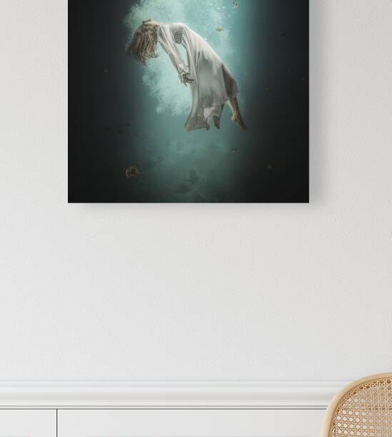 Caucasian woman with long white dress floats underwater  by Gualtiero Boffi