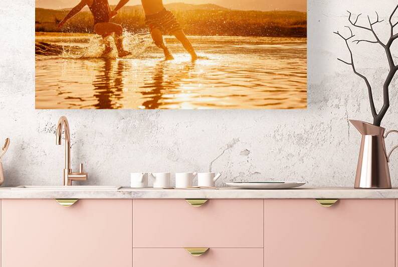 portrait of two children aged 3 and 6 playing in the sea and spr by Gualtiero Boffi