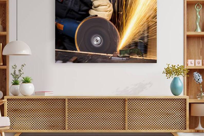 man with grinder in action by Gualtiero Boffi