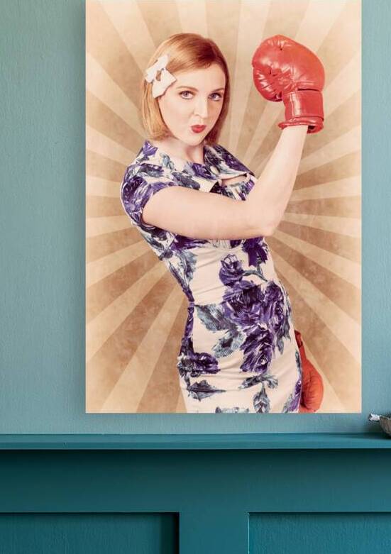 Retro pinup boxing girl fist pumping glove hand  by Jorgo