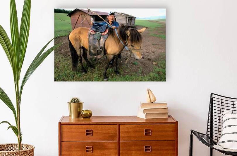 Mongolia. A sheperd in his farm with a horse. by Marco Brivio