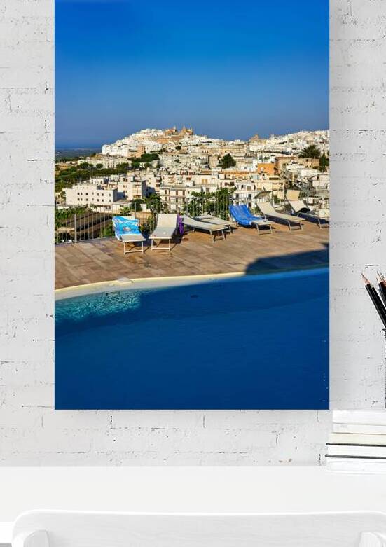 Apulia Puglia Italy. Ostuni. Elevated view of the town from the a rooftop pool by Marco Brivio