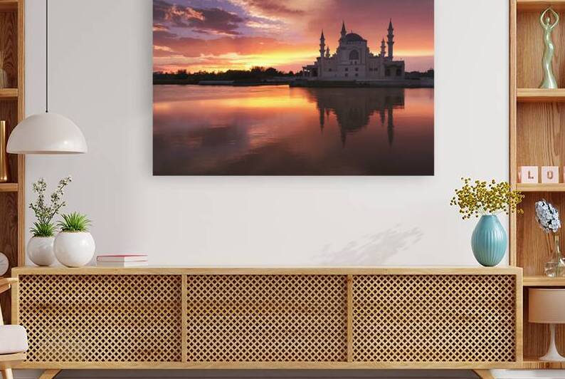 A stunning sunset over a serene body of water wit by IonelGherman