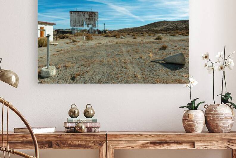 Abandoned drive in theater with a broken screen by David Reinhold