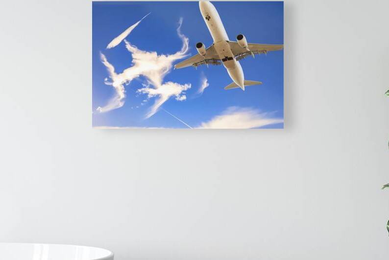 A clear blue sky with a commercial airplane flyin by Veres Ioana