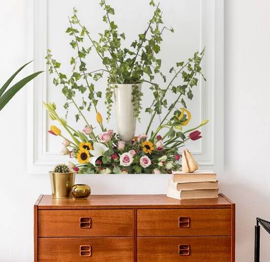 An arrangement of various plants and flowers agai by Veres Ioana