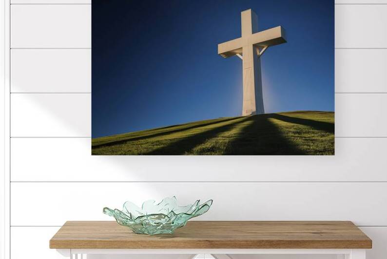 a massive white cross silhouetted against a deep by Stoica Lilian