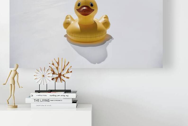 A close up image of a bright yellow inflatable du by Raluca Ciobanu