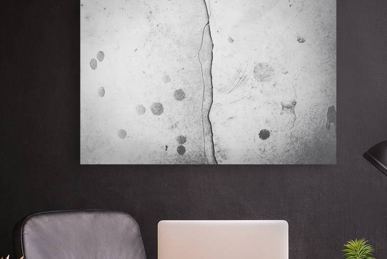 A photo of a textured wall with a large jagged cr by Raluca Ciobanu