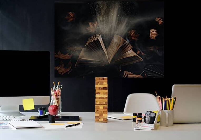 Open magic book with flying autumn leaves and raven black feathe by Jelena Jovanovic Fine Art