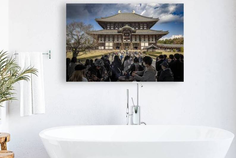 Tourists burning incense at todaiji temple in nara  by Gualtiero Boffi