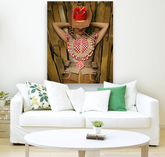 Portrait of a young woman with blond braids wearing a cowboy hat and western clothing all made from fast-food wrappers resting on a pile of French fries by Artmood Visualz