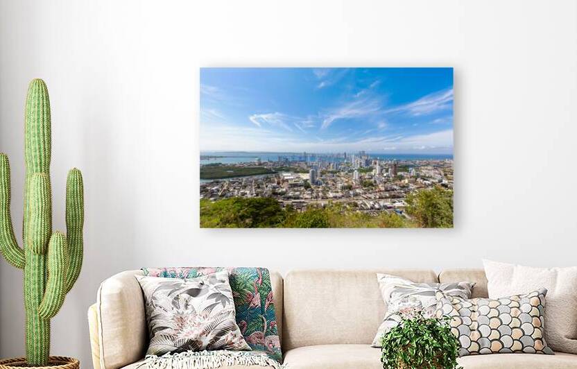 Flag wavering in front of scenic view of Cartagena modern skyline near historic city center and resort hotel zone by Elijah Lovkoff