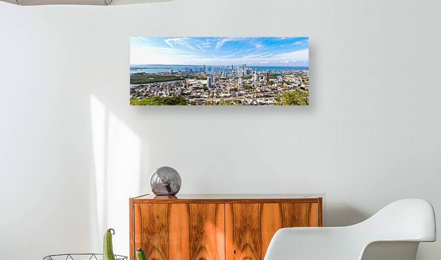 Flag wavering in front of scenic view of Cartagena modern skyline near historic city center and resort hotel zone by Elijah Lovkoff