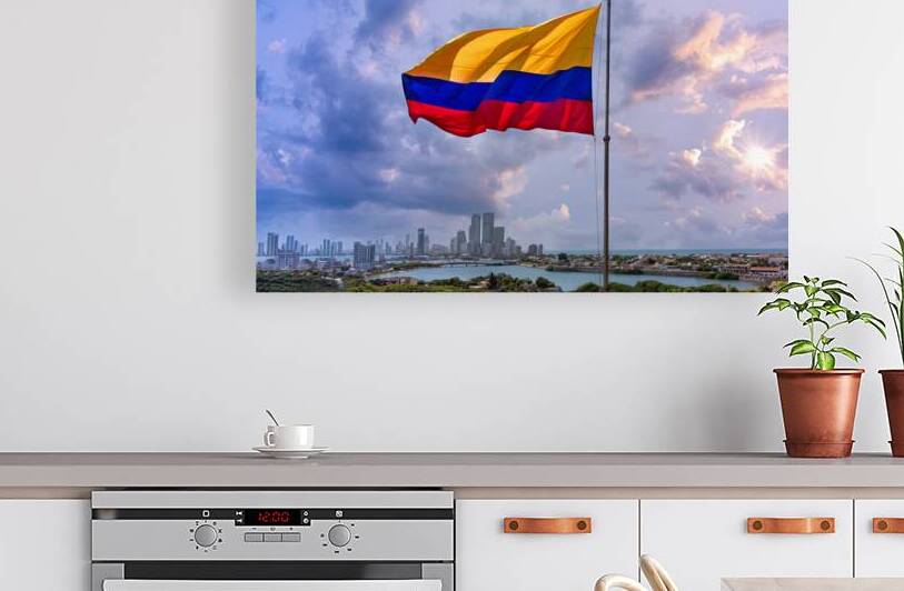 Flag wavering in front of scenic view of Cartagena modern skyline near historic city center and resort hotel zone by Elijah Lovkoff