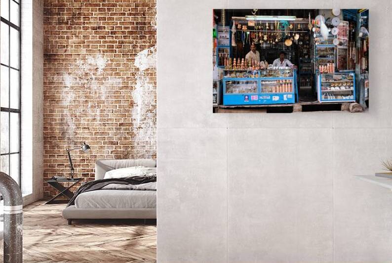 Brass ware shop with vendors in Pushkar Rajasthan India by Dmitry Rukhlenko