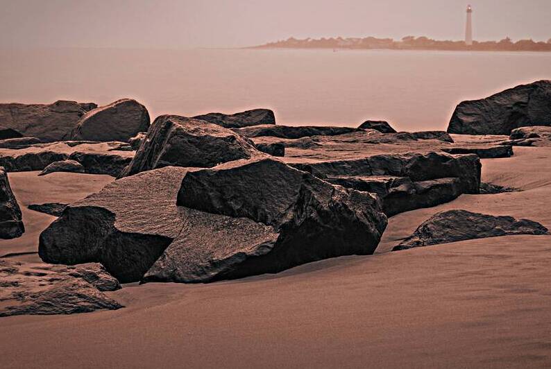 Black Rocks and Drifting Sands of Cape May Beach by Jason Fink