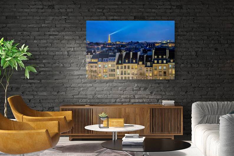 View of the roofs of Paris at night by DELPHIMAGES