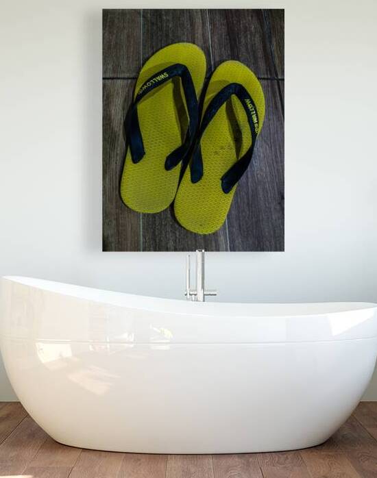 Yellow and Black Flip Flops on Wooden Floor by urbancamshot