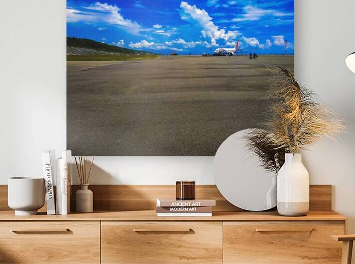 Airplane on Tarmac with Scenic Mountain Background by urbancamshot