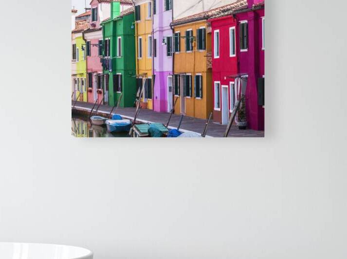 Multi Coloured houses next to a canal Burano Italy by Assaf Frank