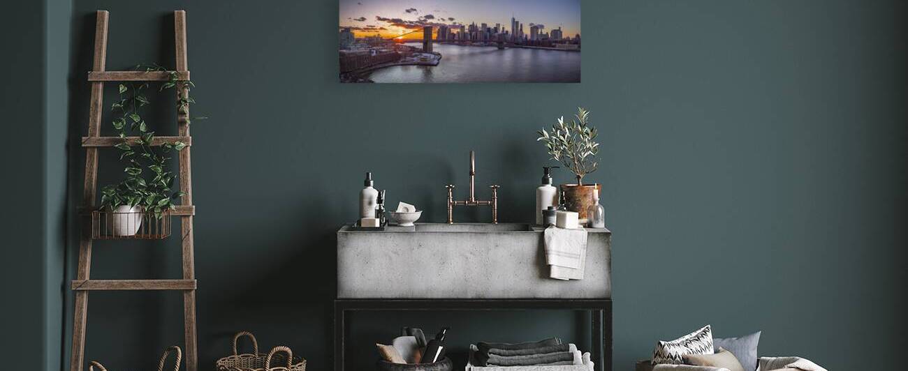 Evening view of Lower Manhattan skyline with Brooklyn bridge over East river New York by Assaf Frank