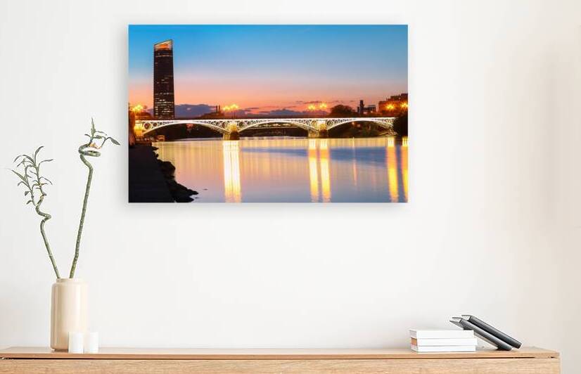 Triana or Isabel II bridge over the river Guadalquivir at sunset Sevilla Andalucia Spain by Kova  