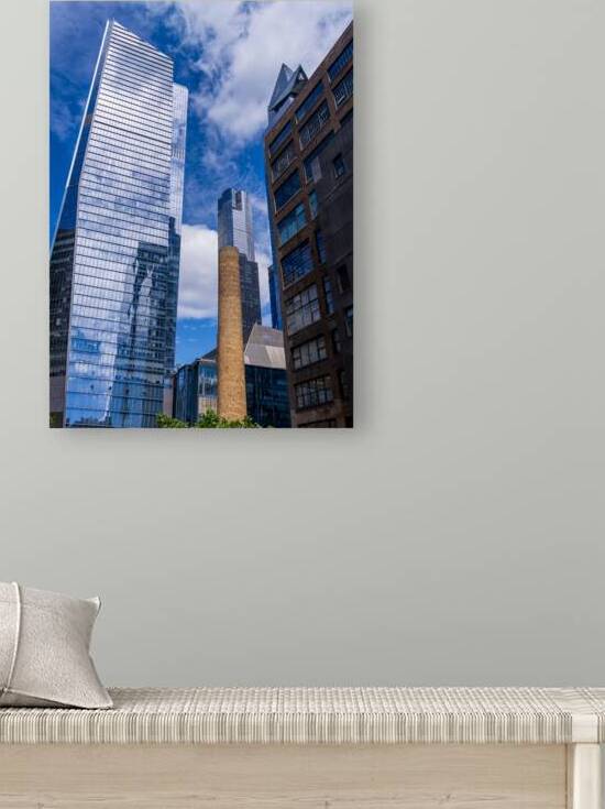 Looking up at modern buildings by brick chimney in Hudson Yards by Steve Heap