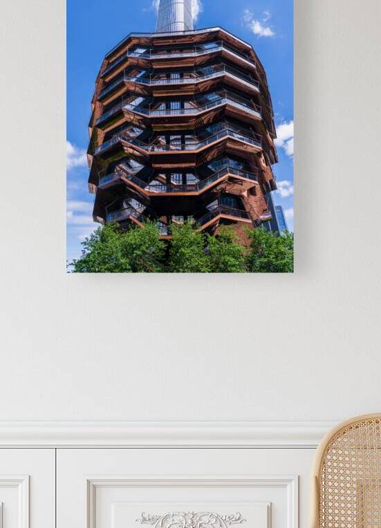 Reflective surface of the Vessel with a skyscraper behind with c by Steve Heap