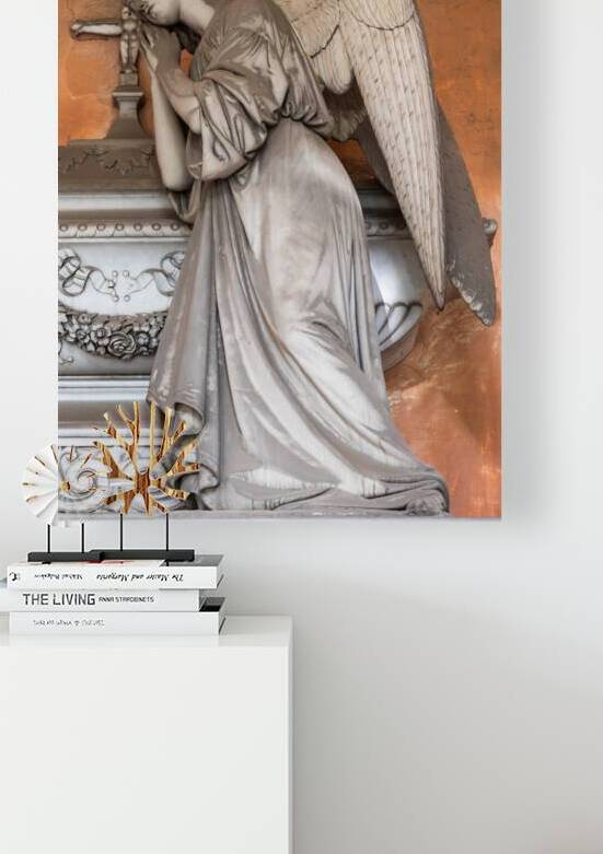 Antique statue in old European cemetery. Angel praying and cover by Paolo Modena