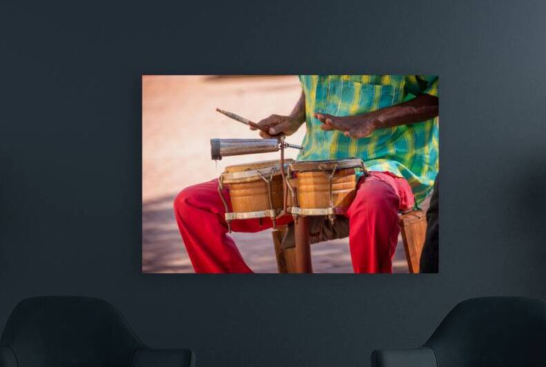 Street musician playing drums Cuba by DELPHIMAGES