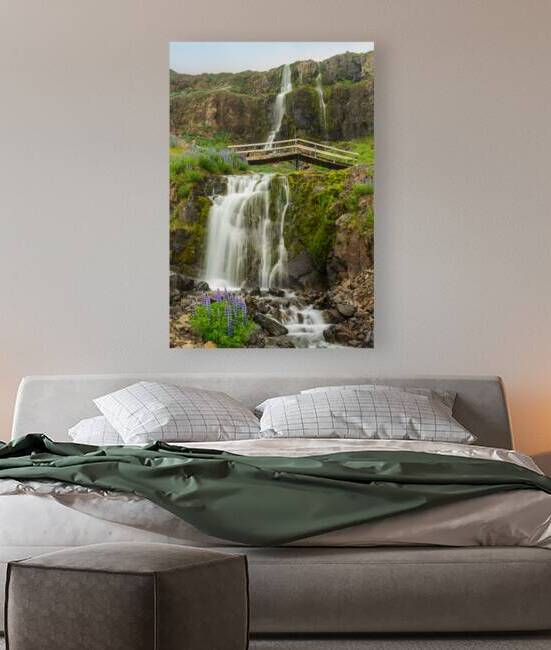 Budareyrarfoss waterfall cascades down the mountain by the port  by Steve Heap