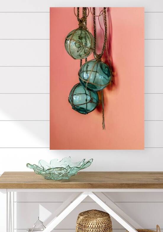 Glass fishing floats hanging on a wall by Lisa von Biela