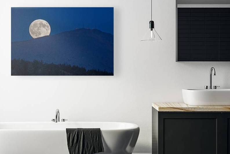 Moon peeks over mountain by Geoffrey Prior